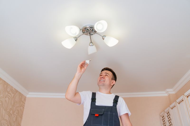 Handyman Installing Light Fixture